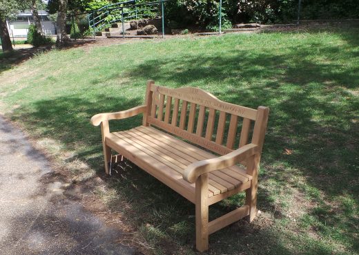 Mendip bench with bespoke top rail in East Park