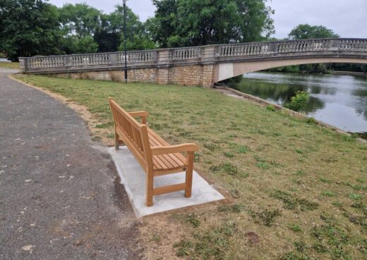 Side view of handcrafted York memorial bench installed beside the lake in East Park, Hull