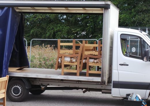 York wooden benches being loaded on to the lorry ready for dispatch to Green Park village near Reading