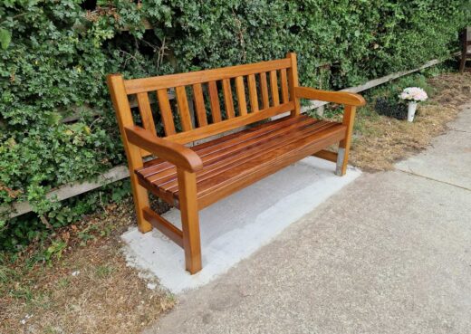 Handcrafted York bench installed on a concrete base at Hedon Road Cemetery, Hull.