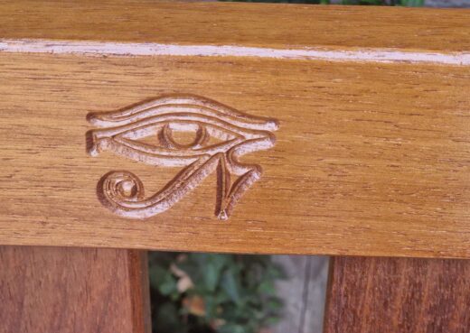 York bench with the Horus eye engraved into the top rail