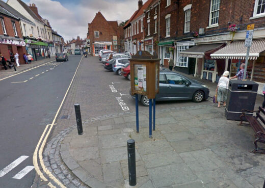 Bespoke three-sided timber community notice board handcrafted by Woodcraft in Hedon town centre.