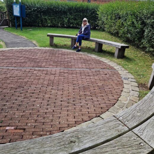 Two curved wooden benches made by Woodcraft for the circular seating area at Pannett Park
