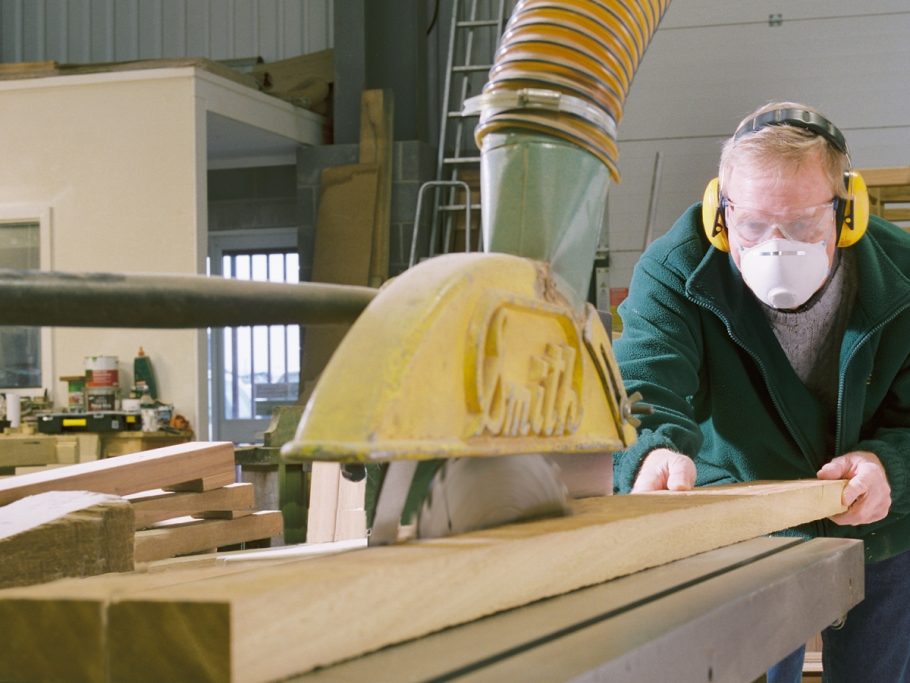Mike Davidson cutting timber lengths for a large wooden bench