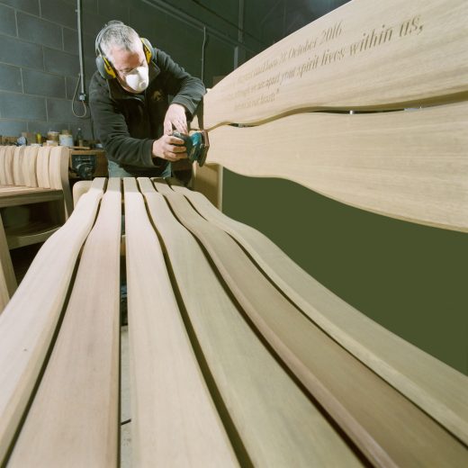 Garry planing the Waveform garden bench