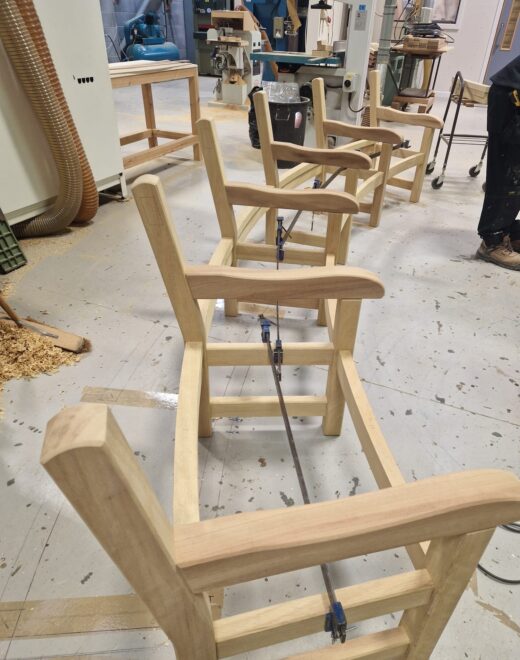 Aligning all sections of the curved wooden bench frame