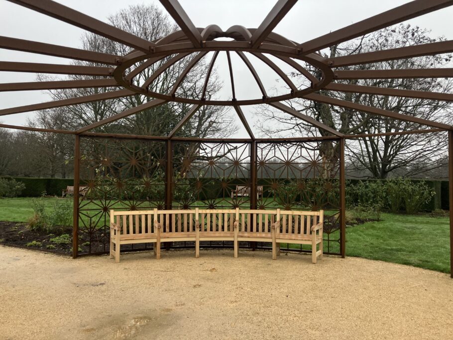 Curved York memorial bench installed beneath pergola in Rose Garden, Greenwich Park