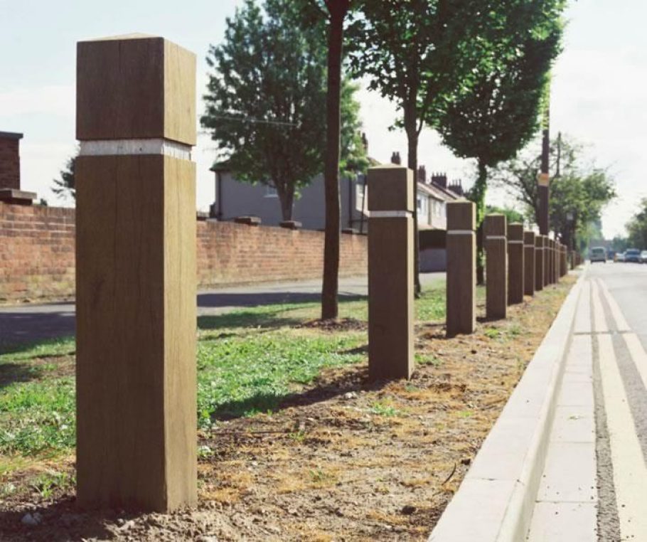 Wooden roadside bollards placed in order to prevent off road parking