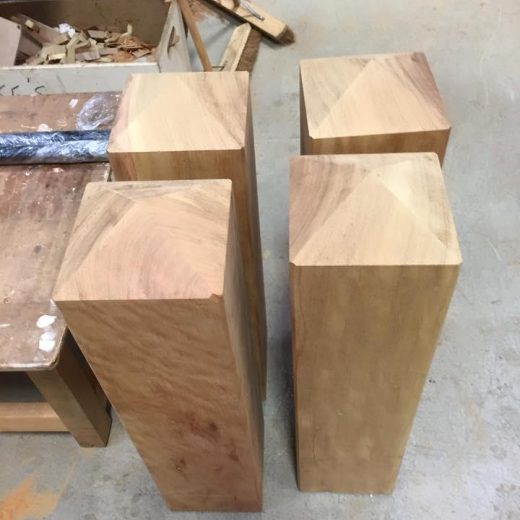 Four timber bollards in production