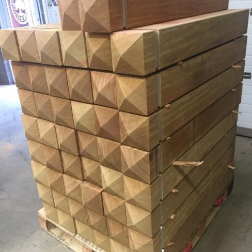 A pallet of heavy duty roadside wooden bollards