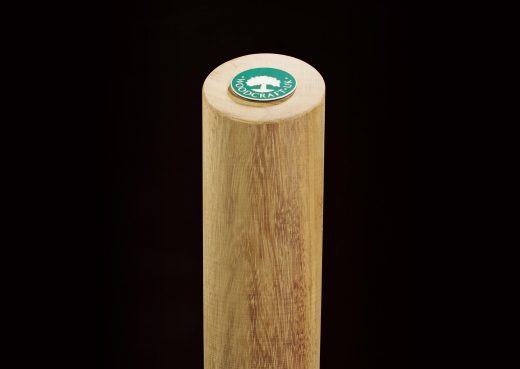 Cylindrical wooden bollard