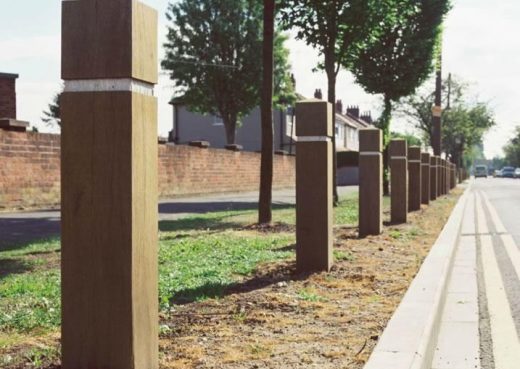 Wooden roadside bollards placed in order to prevent off road parking