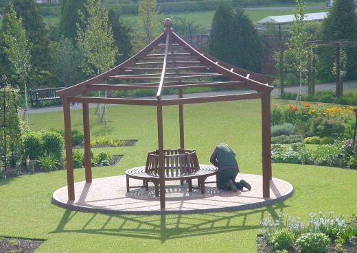 Putting the finishing touches to the circular bench in the gazebo