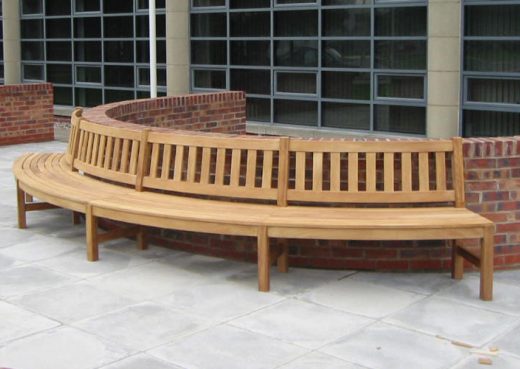 A bespoke curved wooden bench designed for street seating