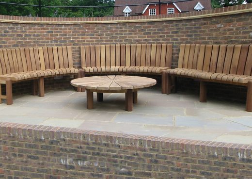 Curved urban furniture for a tennis court